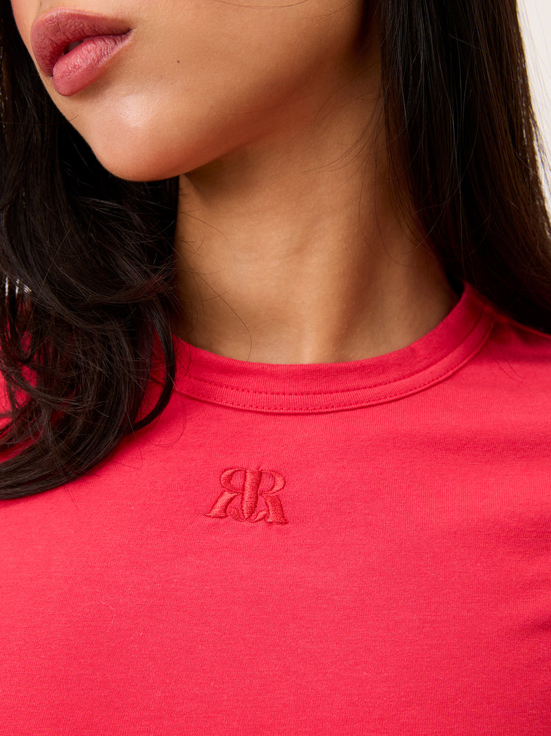 AURELIO red embroidered logo T-shirt worn on a model by Rouje