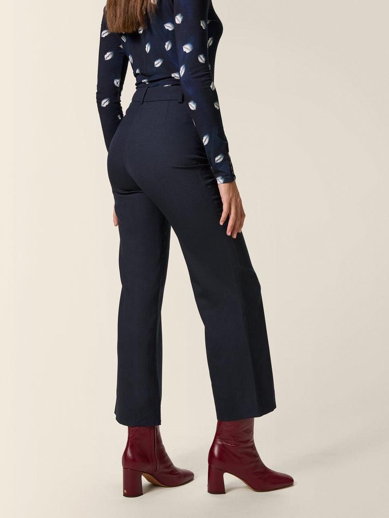 SWAN midnight wool flare trousers, detail of welt pockets by Rouje